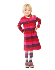 Image showing Confident, girl and portrait of child with fashion, style and smile in white background of studio. Happy, face and kid with hands on hips, relax and excited for kindergarten in pink dress or outfit