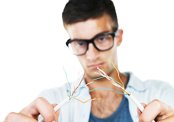 Image showing Electrician, working and man with cables, test and and check for power in white background. Studio, technician or electricity, wires and maintenance of connection, technology or hardware closeup