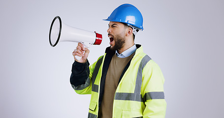 Image showing Construction, angry man and megaphone for shouting in studio with mock up on white background in Mexico. Person, engineer or manager with frustrated face for loudspeaker, workplace and instruction