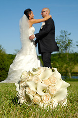 Image showing Wedding bouquet and couple