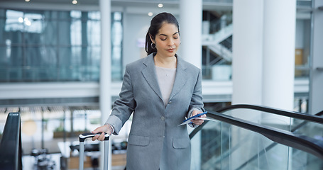 Image showing Business, escalator and travel with woman, smartphone and social media with accountant, suitcase and ticket. Person, employee and broker with a cellphone, airport or convention with connection or app