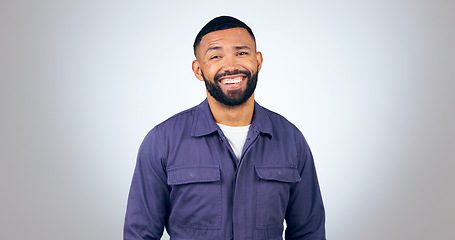 Image showing Portrait, laugh and happy business man in studio with humor, joke or funny personality on grey background. comic, face and isolated entrepreneur with confidence, positive attitude or feel good mood