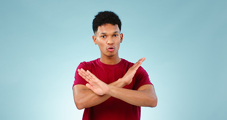 Image showing Portrait, man and cross for no in studio for mockup of protest, rejection and warning with sign. Male model, talking and opinion on human rights, equal pay or social justice in space with gesture