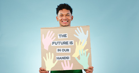 Image showing Man, protest poster and studio portrait for accountability to stop climate change by blue background. Happy volunteer person, social responsibility and vision for future, sustainability and ecology