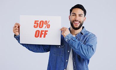 Image showing Man, poster and excited with sale in portrait, shopping discount and retail announcement by studio mockup. Young person, paper and board for sales promotion with news launch by white background