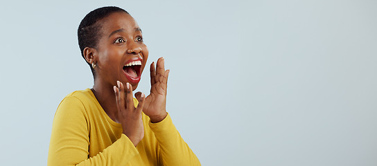 Image showing Happy black woman, face and screaming in surprise, winning prize or celebration against a studio background. Excited African female person in wow, shock or bonus promotion on sale discount or deal