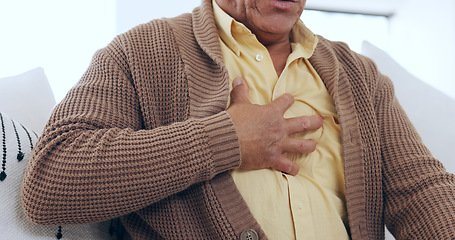 Image showing Closeup, home and old man with heart attack, hands on his chest and heartburn in a lounge. Elderly person, pensioner and senior guy with emergency, wellness and issue with asthma or tuberculosis
