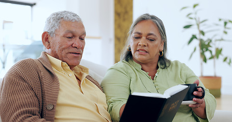 Image showing Senior, couple and bible with coffee for religion, worship and spiritual on sofa in living room of home. Elderly, man and woman with book of God on couch for faith, christian and trust with happiness