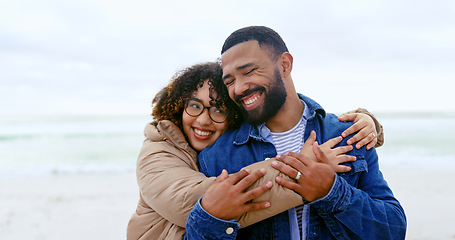 Image showing Beach, love and happy couple hug, smile and travel together on marriage partner vacation, holiday or outdoor wellness. Freedom, tropical nature and relax man, woman or people embrace, support or care