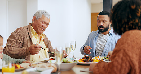 Image showing Love, thanksgiving and a family at the dinner table of their home together for eating a celebration meal. Food, holidays and a group of people in an apartment for festive health, diet or nutrition