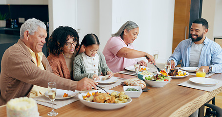 Image showing Happy family, food and smile in dining room of home for dinner, lunch or event for bonding and care. People, parents and grandparents with child at table in lounge for celebration, love and smile