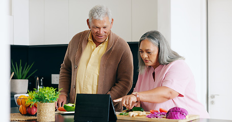 Image showing Senior, couple and cooking in kitchen with tablet for dinner, lunch or vegetables with support, help and love. Elderly, man and woman with watching, peace and nutrition for bonding or relationship