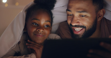 Image showing Father, daughter and tablet at night with internet for movie, cartoon or streaming with blanket on bed in bedroom. Family, man and girl child with technology in the dark for film, video and bonding