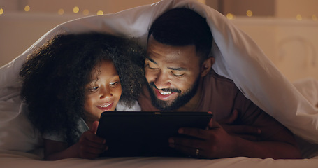 Image showing Dad, daughter or tablet at night and internet for movie, cartoon or streaming with blanket on bed in bedroom. Family, man or girl child with technology in the dark for film, video and bonding in home