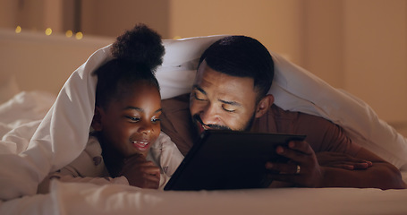 Image showing Father, daughter and tablet at night with internet for movie, cartoon or streaming with blanket on bed in bedroom. Family, man and girl child with technology in the dark for film, video and bonding