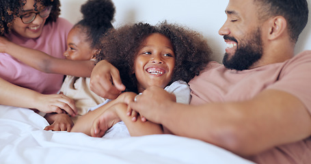 Image showing Funny, bed and family with parents, children and happiness with love, bonding together and relax. Mother, father or kids in a bedroom, humor or laughter with peace, morning or home with weekend break