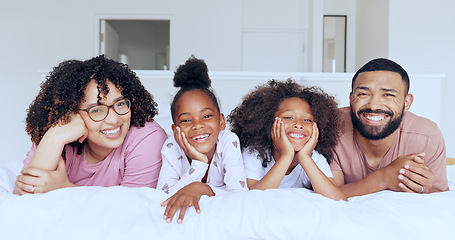 Image showing Family in portrait with kids on bed, morning bonding together for love and memory in home. Bedroom, happy parents face and mom, dad and children in apartment with smile, relax with mother and father.