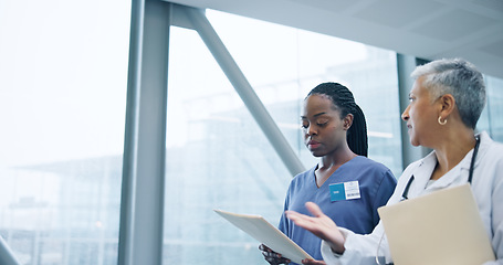 Image showing Doctor, healthcare report and nurse with question for reading, hospital corridor and confused by medical results. Women, specialist and young medic with patient information, diversity and teamwork