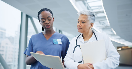 Image showing Doctor, healthcare report and nurse with discussion for collaboration, hospital and assessment by medical results. Women, specialist and young medic with patient information, diversity and teamwork