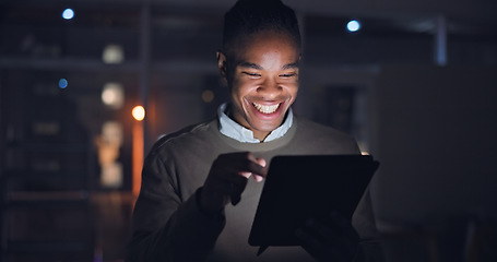 Image showing Businessman, night and tablet with smile in office, reading search with career progress in company. Black man, happy or touchscreen for email on project growth, web or feedback on startup expansion