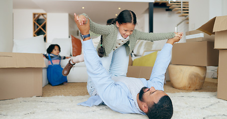 Image showing Father, daughter and airplane or play in new home with happy, fun and bonding for relocation in hallway. Family, man and girl kid or lifting in knees for game or freedom in real estate or apartment