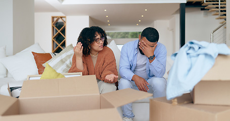 Image showing New home, box and frustrated couple on sofa for house, property investment and moving day. Conflict, argue and man and woman with crisis, problem and fight for mortgage, rent and real estate purchase