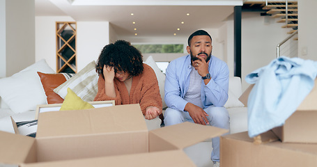 Image showing New home, box and frustrated couple for moving, property investment and renting house. Conflict, argue and man and woman with crisis, problem and fight for mortgage, apartment or real estate purchase