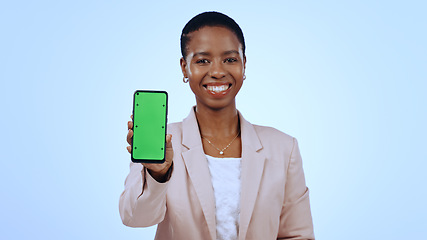 Image showing Happy black woman, portrait or phone green screen mockup for social media advertising. Blue background, review or business person with chroma key on mobile app display for marketing space in studio