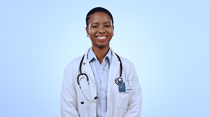 Image showing Portrait, happy woman and doctor with smile in studio for healthcare mockup on blue background in Cape Town. Black person, medical professional and excitement for career, choice and medicine for care