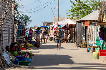 Image showing Locals resting in the shade in front of their markets. Morondava, Madagascar