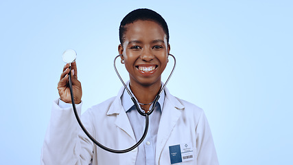 Image showing Happy woman, doctor and stethoscope for healthcare in studio of blue background for mock up in medicine. Portrait, black person and medical professional with smile for wellness, lungs and breathing