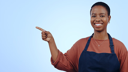 Image showing Woman, portrait and pointing for presentation in studio with smile, announcement or advertising space. Black person, face and smile for marketing, showing deal or discount with hand and joy on mockup