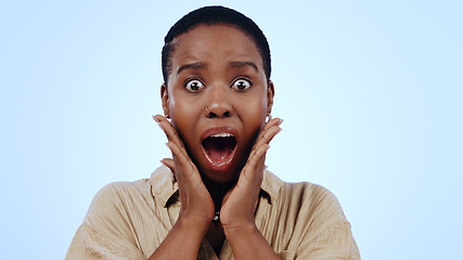 Image showing Woman, portrait or surprised in studio for announcement, notification or overwhelmed on blue background. Black person, hand on face or shocked with wow for gossip, surprise or secret on mock up space