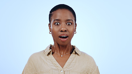 Image showing Woman, portrait and surprised in studio for announcement, notification or overwhelmed on blue background. Black person, face and shocked with wow expression for gossip, surprise or secret on mock up