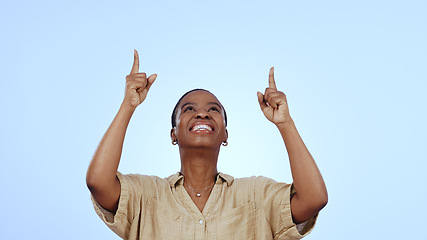 Image showing Woman, point and studio smile for information announcement, feedback for promotion. Black person, model or hand gesture mockup space or blue background for opinion deal, excited or good news review