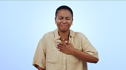 Image showing Black woman, chest and sore throat in heart burn or cough isolated against a studio blue background. Sick African female person or model with respiratory infection, disease or inflammation on mockup