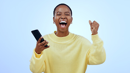 Image showing Woman, phone and wow for happy news, social media competition or giveaway success on a blue background. Portrait of African person with surprise, excited and yes for sale or bonus on mobile in studio