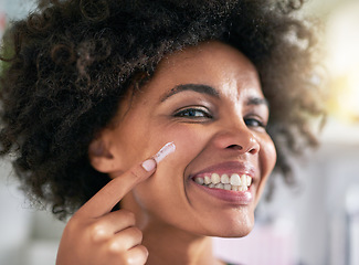 Image showing Portrait, woman and hand with moisturiser for skincare, treatment and facial in home. Black person, happy and smile for dermatology, result and hydration with collagen boost, lotion and sunscreen