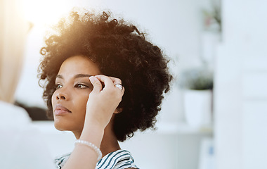 Image showing Woman, beauty and face with makeup artist for eyeshadow, blush or foundation by hand. Black model, hair or afro with determined, expression or look for application of cosmetic product with lens flare