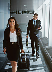 Image showing Walking, portrait or business woman in airport with suitcase, luggage or baggage for a global trip. People, happy or corporate workers in lobby for holiday travel or journey on international flight