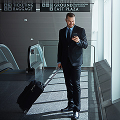 Image showing Travel, airport or happy business man with phone, luggage or suitcase on social media or waiting. Booking, airplane or corporate worker texting on mobile app on international flight transportation