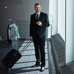 Image showing Social media, thinking or business man in airport with phone, luggage or suitcase for travel booking. Happy, entrepreneur or corporate worker texting to chat on mobile app on international flight