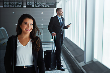 Image showing Walking, happy or worker thinking in airport for business trip with smile for a booking or commute. Opportunity, pride or corporate woman in hall for holiday travel journey on international flight