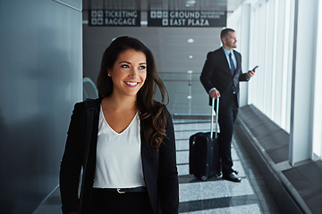 Image showing Walking, happy or woman thinking in airport for business trip with smile for a booking or commute. Opportunity, pride or corporate worker in hall for holiday travel journey on international flight