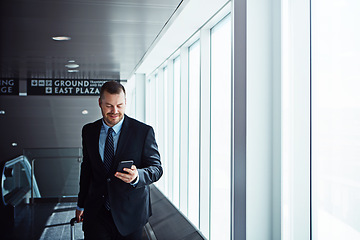Image showing Walking, news or businessman in airport with phone, luggage or suitcase for travel booking. Smile, entrepreneur or corporate worker texting on mobile app or social media on international flight