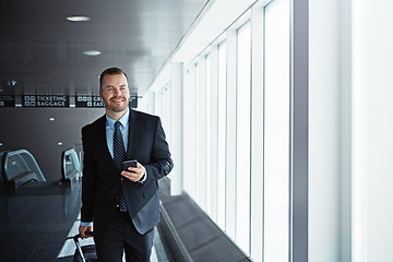 Image showing Business man, phone and luggage in airport for smile, thinking or email notification on international travel. Entrepreneur, bag or smartphone for flight schedule, global immigration or idea in London