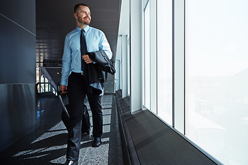 Image showing Walking, flight or business man in airport thinking of company trip with suitcase or luggage for commute. Happy, window or corporate worker in hallway for journey or international travel with pride