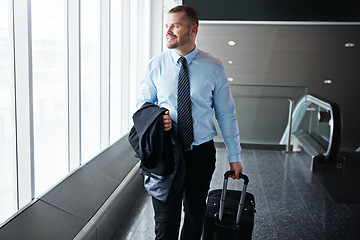 Image showing Walking, smile or manager in airport thinking of company trip with suitcase or luggage for commute. Happy businessman, idea or corporate worker in hall for journey or international travel by window