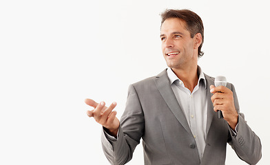 Image showing Man, microphone and smile in speech, studio and motivational or public speaker, tv and white background. Happy mature person, broadcast and feedback or voice, anchor and media or influencer in mockup