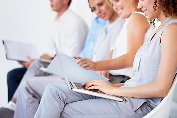 Image showing Waiting room, laptop and business people for recruitment information, job search or human resources opportunity. Professional woman in chair typing on computer, resume update or CV for online hiring